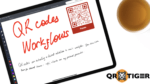 iPad Pro showing a QR code created in QRTIGER, with a cup of tea on the side